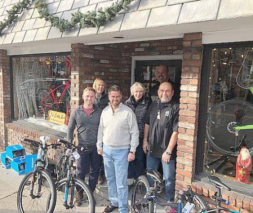 If you don't have a sleigh, try a bike At Joe Fix Its in Goshen, from the left: Board President BB/BS Sean Barton, Carol Kalajian, OCBC donation coordinator; David Jacobsen, executive director BB/BS; Peggy Cullen, OCBC club president; Shaun Hamilton, Joe Fix Its with Brian Dunleavy, owner of Joe Fix Its.