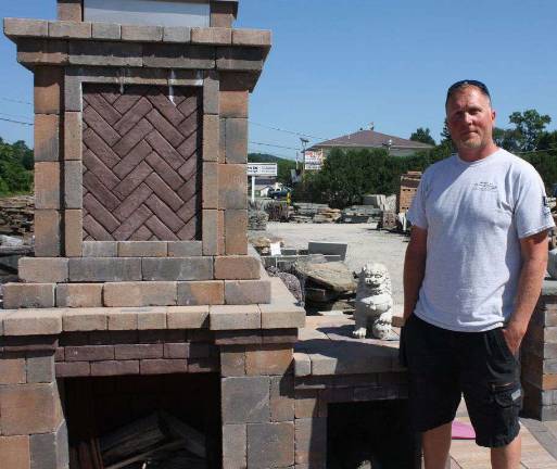 Five Simple Ways to Totally Transform Your Backyard Route 23 Patio and Mason Center manager Sean with an assembled outdoor fireplace kit