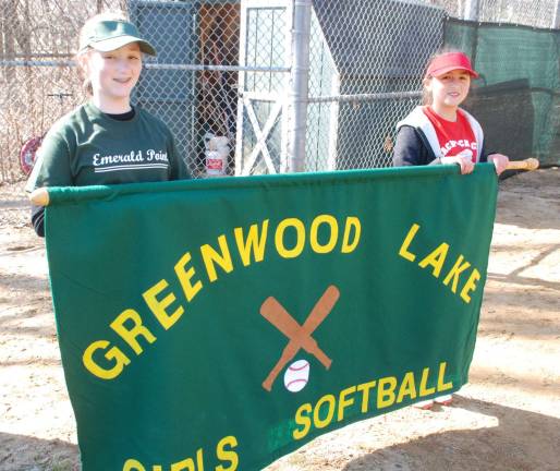 Play ball From left to right: Holding the Greenwood Lake Girls Softball banner are Caroline Rourke, 11, and Jazmihz Bonadie, 9.