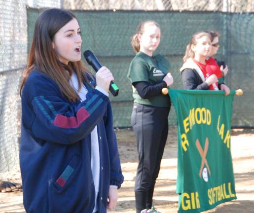 Play ball Olivia Sambataro of Greenwood Lake sand the "Star Spangled Banner" as part of the opening ceremonies.
