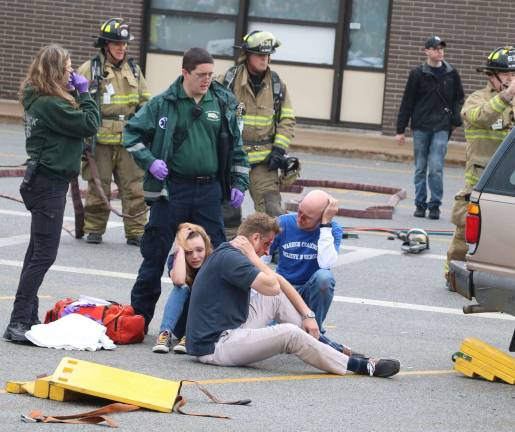'This is not entertainment' Emergency Medical Service (EMS) responders treated the bleeding occupants on the ground.