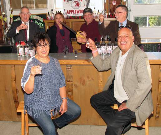 Applewood Winery launches apple vodka Standing from left, are: Warwick Valley Chamber of Commerce Executive Director Michael Johndrow, owners Michele and Jonathan Hull and Town of Warwick Supervisor Michael Sweeton. Seatedare Chamber Board of Directors past president Sherry Bukovcan and member Wayne Paterson.
