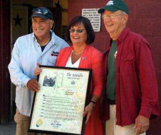 Masker’s Orchards celebrates 100th anniversary Provided photo From left, George Vurno, Assemblywoman Annie Rabbitt and Victor Ludmerer. # # #