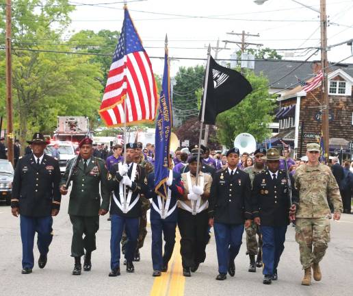The tradition continues Photos by Roger Gavan New York Task Force Commander Col. Peter Riley (far right) along with members of Warwick’s well-known Stewart family of military servicemen marched with the color guard followed by local officials, veterans and other organizations.