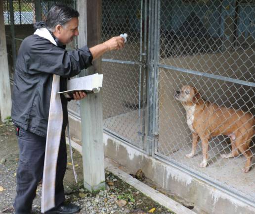 Warwick Valley Humane Society holds blessing of animals at its animal shelter Photos by Roger Gavan Father Jamie Bono individually blessed every kennel resident.