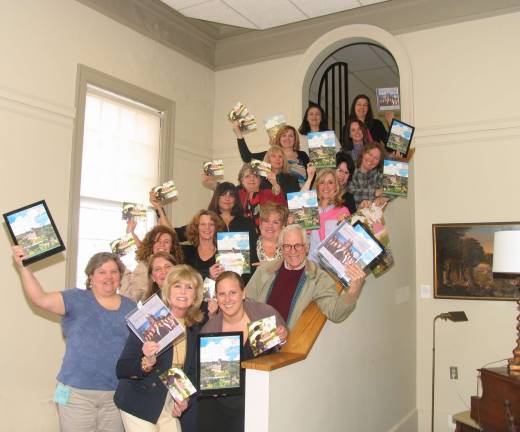 An After to Remember to support St. Anthony Hospital, Warwick Historical Society Benefit committee members for the upcoming May 5 event, An Afternoon to Remember, meet to go over last minute details for the high tea at Lewis Park - with posters that promote the raffle trip to the real life Downton Abbey itself.
