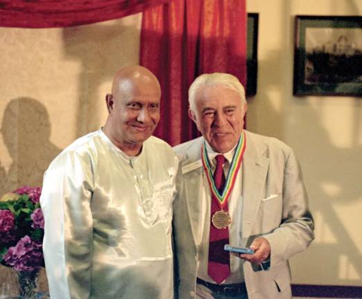 Art exhibit to feature colorful acrylic paintings Ben Gilman with Sri Chinmoy who had just presented Gilman with the þÄúLifting Up the World With a Oneness-HeartþÄù award.