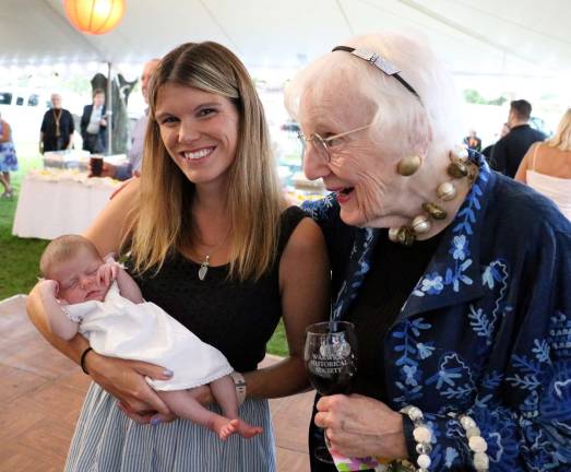 Celebrating Warwick's history Lilibet Lewis McLean admires the youngest member of the Wright family, Brynley, 4 weeks old, in the arms of her mom, Kerri Wright La Penna.