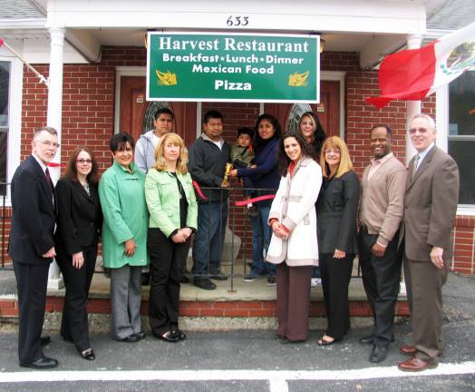 Harvest Restaurant celebrates Warwick Valley Chamber membership with ribbon-cutting ceremony On April 26, public and chamber officials joined owner/chef Jorge Torres, his wife and staff for a ribbon-cutting ceremony at Harvest Restaurant, 633 County Route 1 in Pine Island. Front from left, Town of Warwick Supervisor Michael Sweeton, Warwick Chamber Director Susan Ronga, Vice President Sherry Bukovcan, Pine Island Chamber President Marlene Caraballo, Warwick Chamber Director Vikki Garby, Treasurer Mary McClurg, President Cedric Glasper and Executive Director Michael Johndrow; and rear from left, assistant cook Cessar Torres, Jorge and Galdina Torres with their son Diego, 2, and waitress Adeline Kulik.