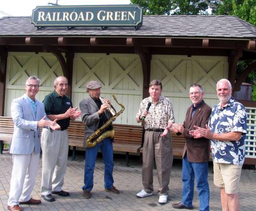 All good things must end - at least for the season Photo by Roger Gavan Dick Wells and Jim Perry give a sample performance of their Sept. 15 concert for those who helped establish and support the concerts at Railroad Green. From left, Mayor Michael Newhard, Leo Kaytes, Jim Perry, Dick Wells, Town of Warwick Supervisor Michael Sweeton and former Village Trustee Bill Iurato.