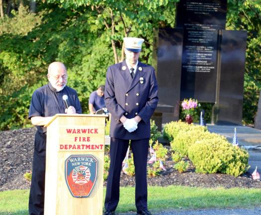 Warwick Fire Department Chaplain Rev. Jack Arlotta, pastor of the RC Church of St. Stephen, the First Martyr, gave the invocation after Past Warwick Fire Department Chief Jason Brasier welcomed local residents, public officials, veterans and members of the Warwick Police, Ambulance Corps and Fire Departments, and others gathered in Veterans Memorial Park who were there to honor the victims of that attack, especially those who lived in Warwick.