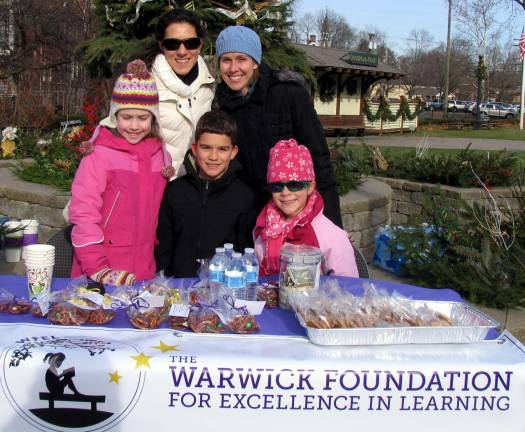 Volunteers raise funds for the Warwick Foundation for Excellence in Learning On Saturday, Nov. 30, volunteers for the Warwick Foundation for Excellence in Learning were stationed outside Railroad Green on Small Business Saturday, a busy shopping day, to raise funds by selling refreshments to passers by. Rear from left, Vikki Garby and Venessa Holland. Front from left, Olivia Holland, 7, Zachary Garby, 9, and his sister Melina, 7, all students at Park Avenue Elementary School.