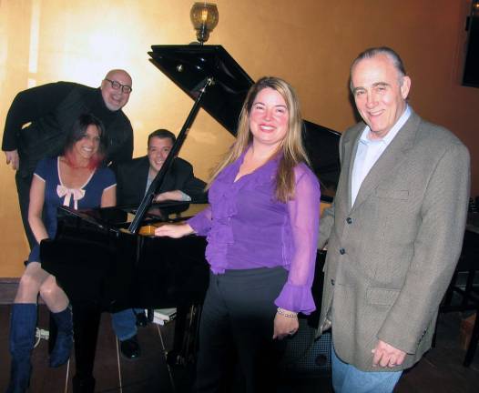 Sing Along Sundays to be featured at Warwick Wine Garden and Piano Bar Photo by Roger Gavan From left, Tim Mullally, Terry Odell, Jim Quinlan and owners Marilyn and Chris Littell.