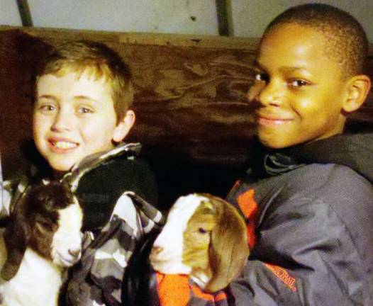 Orange County 4-H offers Borrow A Goat program for young people Garrett Boelens and Bryan Vil show their "Borrow a Goats."