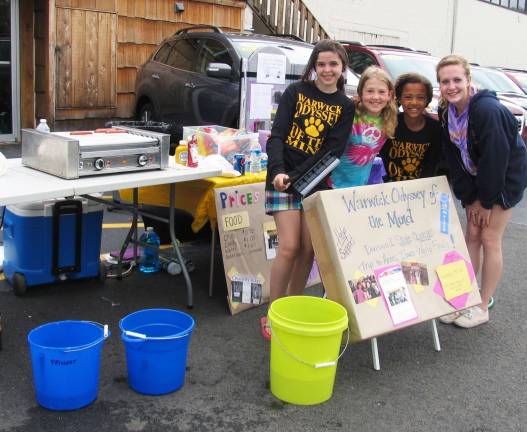 Odyssey of the Mind Division Champs fundraising for world finals Photo by Roger Gavan Members of the former Odyssey of the Mind Sandfordville Elementary team (this year known as the Warwick UM team) were busy washing cars and sellling snacks at Leo Kaytes Ford on Saturday, May 5, to raise enough money to travel to the May 23-26 World Finals in Iowa. From left, Gabrielle Goodman, 10, Katherine Pfingst, 9, Taina Gamory, 10 and Coach Taylyn Carter.