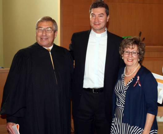 Orange County welcomes 86 new U.S. citizens from 39 countries Orange County Family Court Judge Andrew Bivona and Orange County Clerk Donna Benson stand with newly naturalized citizen Gonzalo Arias Cardenas on July 12 at the Orange County Courthouse in Goshen. A total of 86 people from 39 countries swore their allegiance to the United States of America.