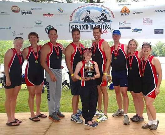 Beginning in the back row, from left to right, the East Arm Rowing Club Mixed 8+ National Champions are: Catherine Cody, Kate Glover, Jim Cody, Brian Walk, Craig Shepherd, Robert Zimmer, Cathy Lucking and Jean Zimmer; standing in front is Heather Brooks Franklin.
