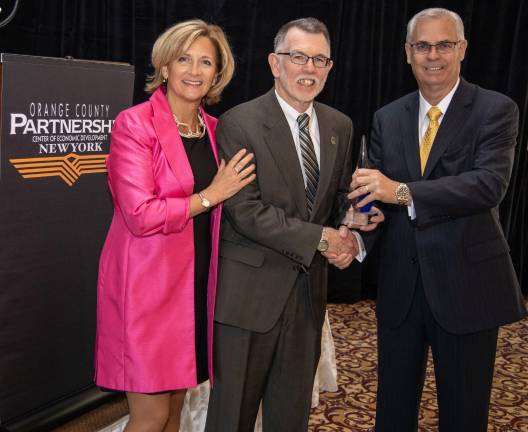 Warwick Supervisor Michael Sweeton named Orange County Partnership's Most Valuable Partner Provided photo On Tuesday, June 4, Town of Warwick Supervisor Michael Sweeton was named the Orange County Partnership's Most Valuable Partner for 2019. From left, Maureen Halahan, president and CEO of the Orange County Partnership, Warwick Supervisor Michael Sweeton and Orange County Partnership Board Chairman Robert Kaehler, the president of Perreca Electric.