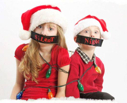 Vote for the best holiday photo Submitted by: Cristina Kiesel of Monroe, N.Y. "A brief moment of silence with the Kiesel kids."