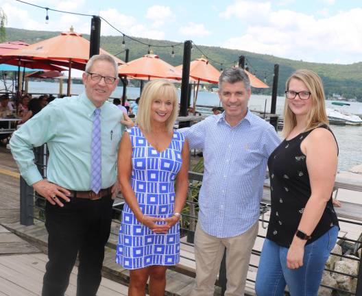The Warwick Valley Chamber of Commerce Aug. 28 lakefront business mixer are, from left: Warwick Valley Chamber of Commerce Executive Director Michael Johndrow, Programs Director Janine Dethmers, Cove Castle Owner Bob Pereira and Chamber Office Manager Bea Arner.