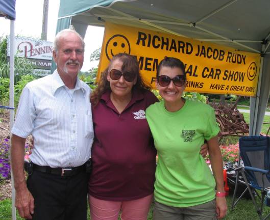 Eighth-annual Richard Jacob Rudy Memorial Car Show held at Pennings Farm Market Gary Rudy, vice president of the RJR Memorial Fund, his wife, Cathy, and Katie Rudy, president of the RJR Memorial Fund.