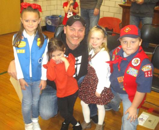 Veteran Shawn Garley poses with relatives Katherine O’Brien, Olivia O’Rourke, Stella Garley, and Billy Boman.