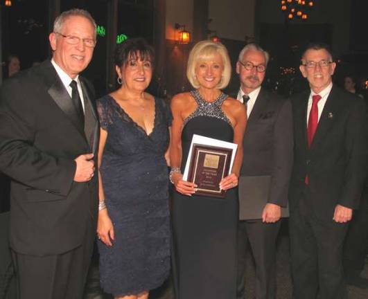 Seventy-five years in the making Janine Dethmers of Corporate Impressions was named Volunteer of the Year. Dethmers also served as chair of this year's gala. From left, Executive Director Michael Johndrow, Chamber President Sherry Bukovcan, Janine Dethmers, Mayor Michael Newhard and Town of Warwick Supervisor Michael Sweeton.