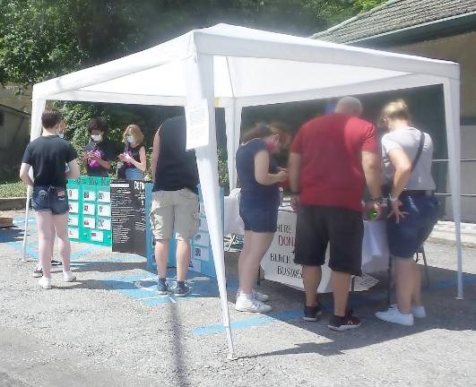 People visited tents to learn about local politics; Black-owned businesses, where to donate to Black Lives Matter; how to be an ally and acknowledge your privilege; and defunding the police and Black history.