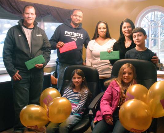 Regal Homes & Properties announces winners of Holiday Light Show Provided photo Front from left, Paige Pappas, 6, and her sister Andrea, 9. Rear from left, Second place winner Rocco Manno, third place winner Jeremy and Tonia Hudson, and first place winner Toni Ann Pappas and her son Robert, 11.