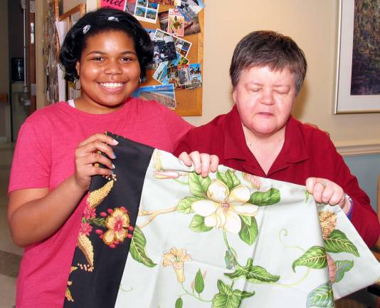 Middle School students present handmade pillow cases to Mount Alverno residents Medina Rier presented a pillowcase and described it in detail for Mount Alverno resident Frances Mauser, who is visually impaired.