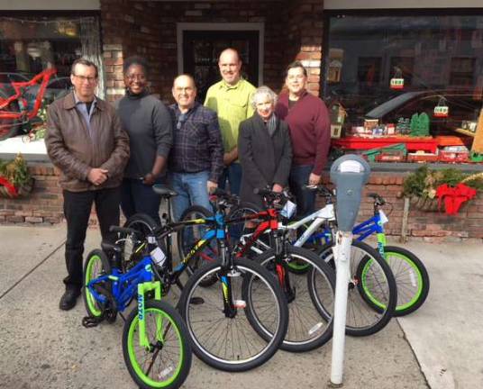 Ride! Photos provided Don Karlewicz, left, club treasurer; Sharon Williams, Big Brothers/Big Sisters executive director; Brian Dunleavy, Joe Fix It’s; Shaun Hamilton, Joe's Fix It's; Peggy Cullen, club vice president; and club president Bill Stelz with the bikes that were presented to Big Brothers/Big Sisters.