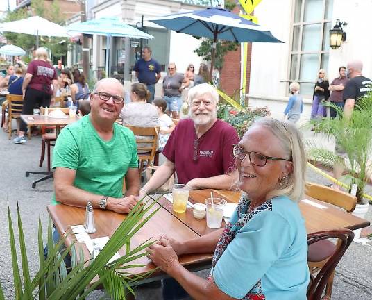 Yesterday’s Proprietor John Christison (center) removed his mask to pose for a photo with diners Robert and Sally Scheuermann, owners of Scheuermann Farms in Pine Island.