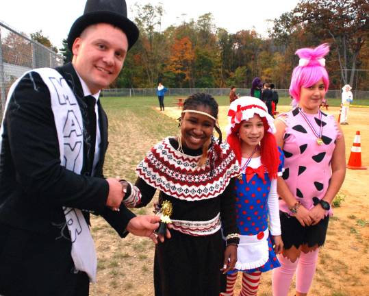 Greenwood Lake gets an early start for Halloween Age 8 to 10 year old winners with Mayor Jesse Dwyer: Tina Lopez first place, Ann Stedfelt second and Emily Henderson third.
