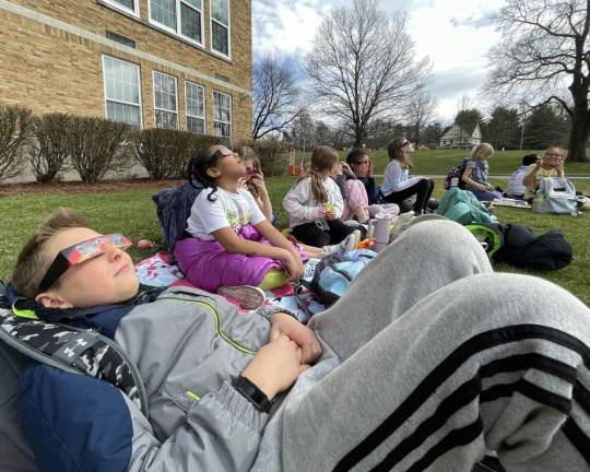 Kids sat back and relaxed as they observed the eclipse take place.