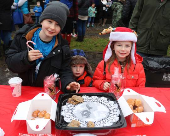 From left, Maddox Eschmann, 9, his brother Cruz, 3, and sister Avery, 6, had an opportunity to enjoy free refreshments provided by Kuiken Brothers.