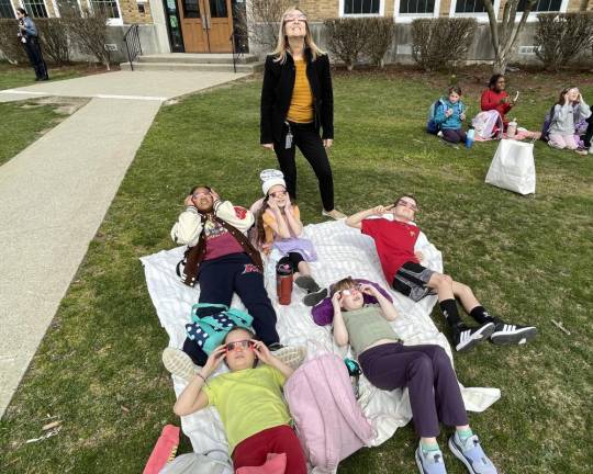 Kids sat back and relaxed as they observed the eclipse take place.