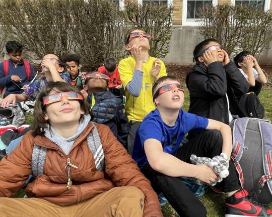 Kids sat back and relaxed as they observed the eclipse take place.