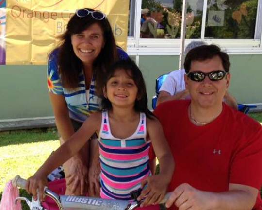 Orange County Bicycle Club helps make Florida Bicycle Rodeo a success Orange County Bicycle Club President Glynis Herrmann and Bill Stelz, communications director, with one of the many kids who had their bikes fixed.