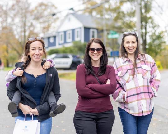 Locals enjoy a walk through Sugar Loaf Fall Festival.