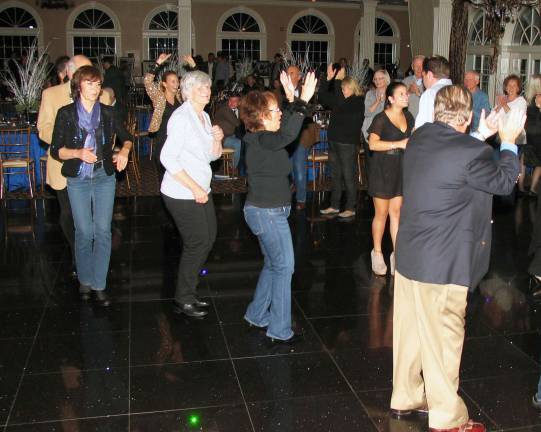 Neither wind, nor rain Guests who supported the event enjoyed a cocktail hour, full course dinner, open bar, festive atmosphere, and dancing to the music of Cloud NYne.