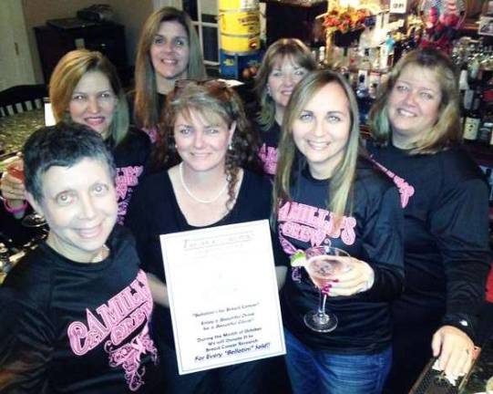 New martini created for a great cause Pictured from left to right are Camille Balsamello, Beverly Janelli, Maria Estevez, Denise Traverso, Colleen Reill, and Denise Terhune (Team Captain). Standing in the center holding the Bellatini sign is Eileen Barclay, owner of the Inn at Long Pond.