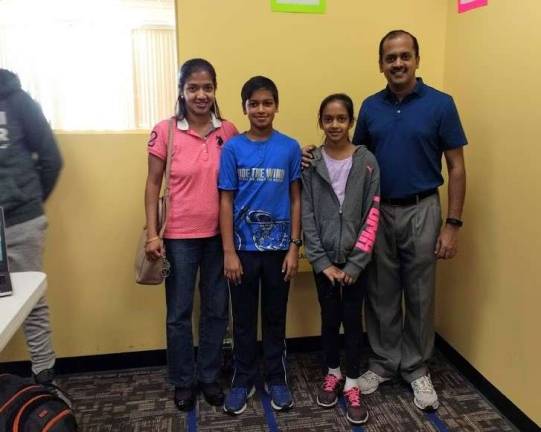 Kids become engineers at Robotics4U Ashok and Swathi Sathiyamoorthy with their parents Deepa and Sathiyamoorthy Kunchithapatham (Photo by Ginny Privitar)