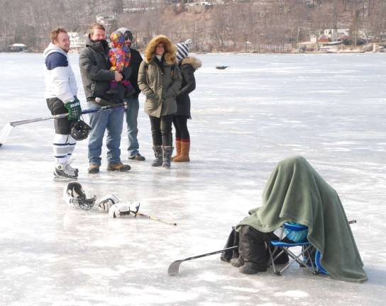 Greenwood Lake hosts outdoor hockey tournament It was so cold on the lake Saturday that one young skater took refuge under a towel.