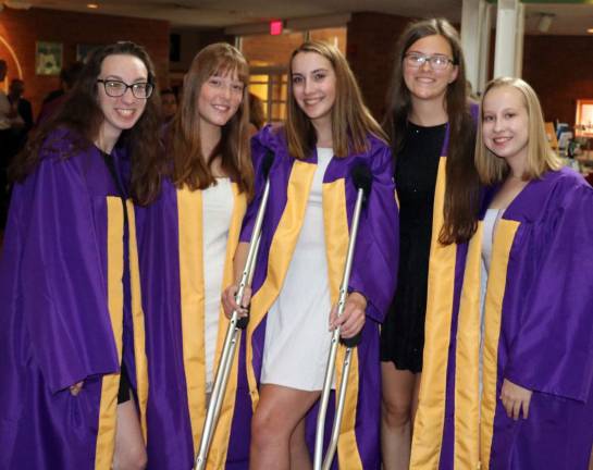 Well-attended Baccalaureate service held at St. Stephen's Church In spite of a torn ligament and having to use crutches, graduate Juliana Noone (center) felt the Baccalaureate was important enough to attend with her friends.
