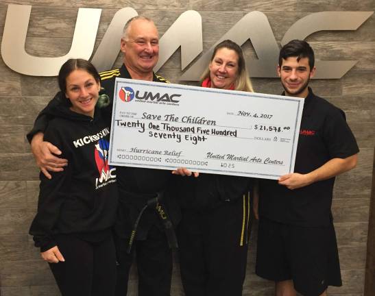 Martial arts schools raises $21,578 for hurricane relief Pictured from left to right are: Master Danielle Ciarfella, Grandmaster Edmund Ciarfella, Master Teresa Ciarfella and Master Jason Bender.