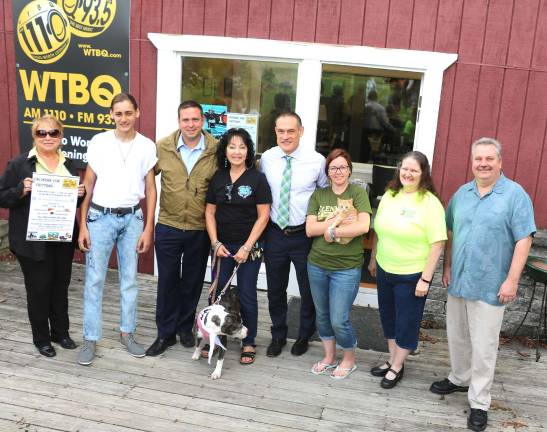 WTBQ to sponsor classic car and bike show for Warwick Valley Humane Society Photo by Roger GavanFrom left, WTBQ Station Manager Taylor Sterling, DJ Shark, County Executive Steve Neuhaus, Suzyn Baron, president of the Warwick Valley Humane Society, Christian Farrell, director of Veteran Affairs for Orange County, Shanna Sandor of Glenmere Brewing Company, Ranae Ruger, owner of Piranha Grill Food Truck, Tom Lovelace, host of The Lovelace Music Experience & The Armonia Band. Not present for the photograph: Frank Truatt, owner of WTBQ, Beth Wilson, owner of The Warwick Drive-In and Liz Cruz, marketing director of Moroney's Harley of New Windsor.