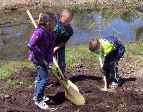 Village of Warwick celebrates Arbor Day Several children from each class were invited to take turns shoveling some dirt to help plant the new tree. Additional photos can be found online at warwickadvertiser.com.
