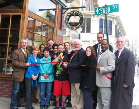 Ye Olde Warwick Book Shoppe opens its first chapter On Friday, April 27, Mayor Michael Newhard, members of the Warwick Valley Chamber of Commerce and other friends and supporters joined partners Thomas Roberts and Joseph Justin for the grand opening of Ye Olde Warwick Book Shoppe. Owners Joseph Justin and Thomas Roberts (center) cut the ribbon held by Mayor Michael Newhard at far left and Cedric Glasper, president of the Warwick Valley Chamber of Commerce at right. At far right is Michael Johndrow, executive director of the Chamber of Commerce.