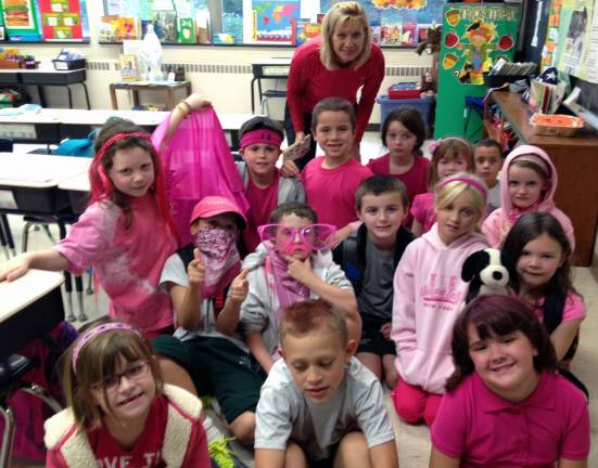 St. Stephen’s School goes pink for Miles of Hope Pictured here are the students from Marianne SimmþÄôs second grade class.