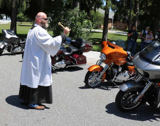 St. Stephen's seventh annual motorcycle blessing and ride draws more than 70 participants Before the ride and after a brief general blessing, Father Micciulla, assisted by members of the Knights of Columbus, blessed each of the bikes individually.